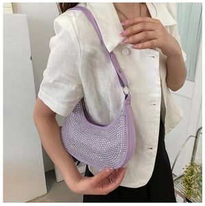 Detail of lavender crescent bag with sparkling rhinestones and silver metal hardware