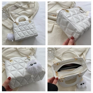Detailed views of white quilted crossbody bag with plush charm and interior storage