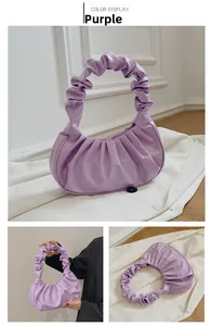Detail view of purple ruched dumpling bag with pleats and pleated top handle detail
