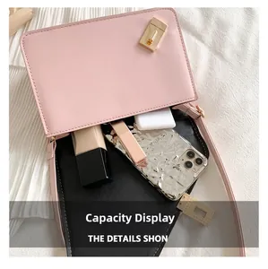Pink crossbody bag interior capacity display showing phone, lipstick, and cosmetics