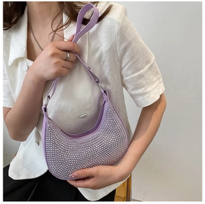 Detailed close-up of lavender hobo bag with sparkling rhinestones and silver chain