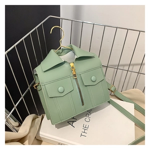 Detailed view of mint green creative jacket-shaped shoulder bag with golden zipper