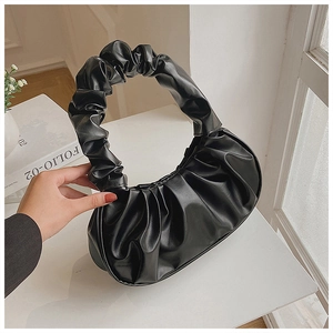 Chic black pleated dumpling shoulder bag with soft PU leather handle in a minimalist style