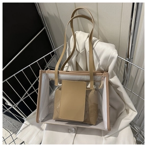 Detail view of khaki PVC transparent tote bag with inner pouch on white suit