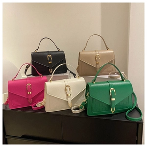 Group shot of colorful shoulder bags featuring crocodile texture and horseshoe buckles