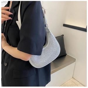 Silver rhinestone baguette bag with crystal embellishments and white leather strap