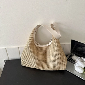 Chic beige straw shoulder bag with cream faux leather trim for summer beach travel