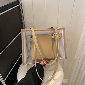Chic transparent PVC tote bag with beige leather trim and matching inner pouch