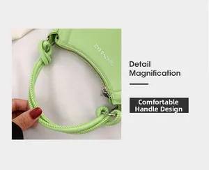 Detail of the light green shoulder bag showing the comfortable woven knotted handle design