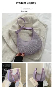 Detailed view of purple crescent bag featuring silver rivet studs and adjustable strap