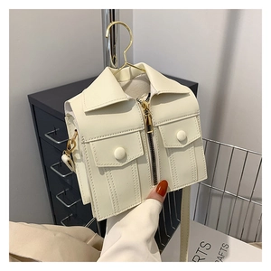 Detail of creative cream white mini jacket-shaped crossbody bag with zipper and lapel
