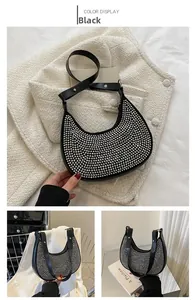Detail view of black hobo bag with silver rivet studs and adjustable strap