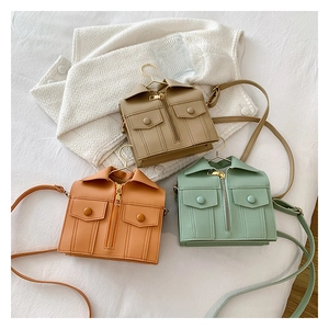 Detailed view of creative jacket-shaped mini crossbody bags in khaki, orange, and mint green
