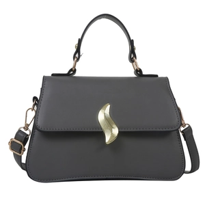 Minimalist dark grey leather handbag with elegant gold wavy clasp and adjustable strap
