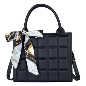 Classic black quilted handbag with elegant printed silk scarf and crossbody strap