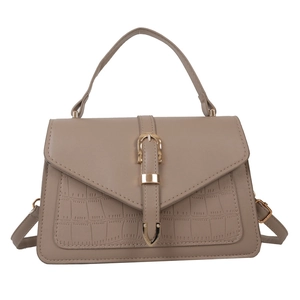 Elegant beige crocodile texture crossbody bag with metal buckle and top handle
