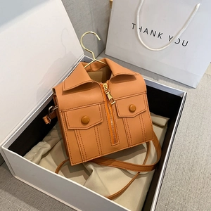 Unique jacket-shaped crossbody bag in tan leather with metallic zipper and gold hook detail