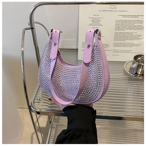 Detail of light purple hobo bag featuring dense rhinestones and silver hardware accents