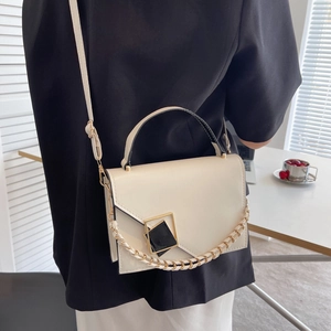 Minimalist beige PU leather crossbody bag with geometric buckle and chain strap shown on model