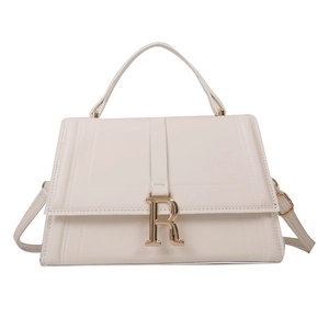 Minimalist beige leather crossbody square bag with golden R-letter buckle and top handle