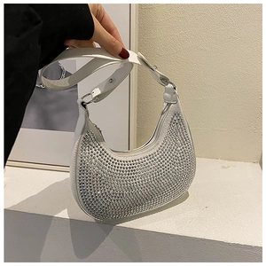 Detail shot of the white hobo bag with sparkling silver rhinestones and smooth PU leather