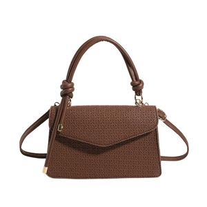 Brown vintage woven leather crossbody bag with top handle and golden hardware finish