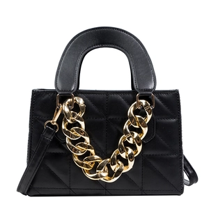 Classic black quilted leather handbag with bold gold chain and adjustable shoulder strap
