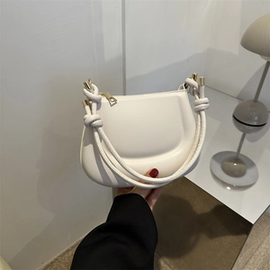 Minimalist white semi-circular PU leather underarm bag with unique knotted rope strap