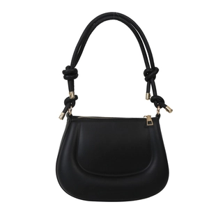 Minimalist black crescent shoulder bag with knotted strap and gold metal accents