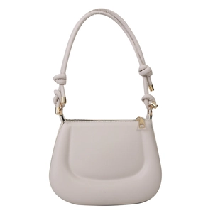 Minimalist beige moon saddle bag with knotted strap and gold hardware on white background