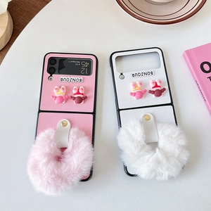 Cute pink and white Samsung Galaxy Z Flip6 case with plush ball and 3D character decor