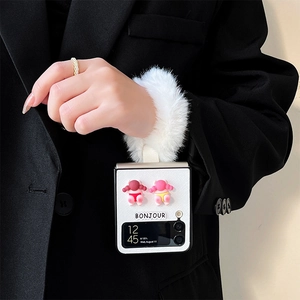 Pink plush wristband case for Samsung Z Flip 6 featuring cute 3D figures and Bonjour text