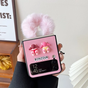 Close-up of pink leather case for Samsung Z Flip with plush handle and cute 3D charms