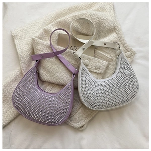 Detail of hobo underarm bags with sparkling rhinestones and elegant chain straps