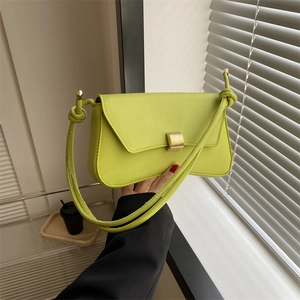 Lime green minimalist baguette bag with gold buckle and knotted shoulder strap detail