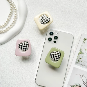 Collage of heart checkerboard phone grip sockets in yellow, pink and green colors