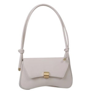 Minimalist beige underarm baguette bag with curved bottom and gold buckle for women