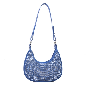 Detailed macro view of vibrant blue hobo bag featuring sparkling silver rhinestones