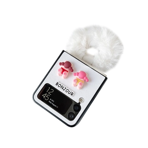 White woven phone case for Samsung Z Flip 6 with plush charm and cute girl figurines