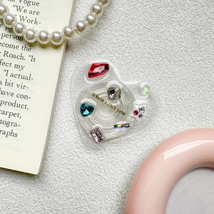 Luxury heart-shaped phone grip with colorful rhinestones and gold 'When I Met You' text