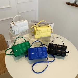 Minimalist square quilted handbags in five colors with matching mini coin pouches and straps
