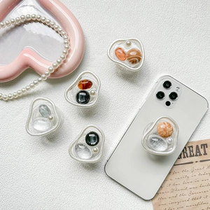 Collage of five luxury marble and pearl phone grip holders in retro ins style