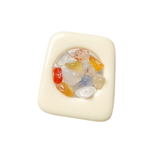 Colorful gemstone expandable phone grip with cream white resin base on white background