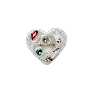 Luxury heart-shaped air cushion phone stand with rhinestones and 'when I met you' text