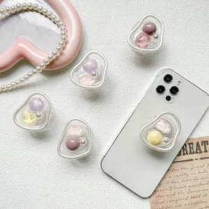 Aesthetic Morandi color beaded expandable phone socket grip on white smartphone
