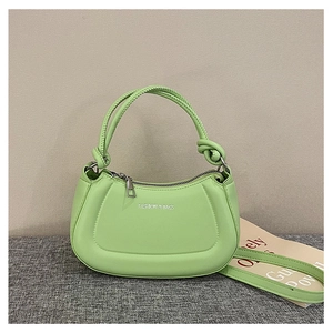 Detail of light green PU leather handbag with silver logo and decorative knot handles