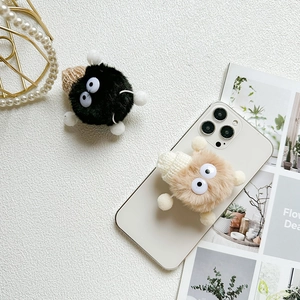 Cute plush cartoon phone grip holder set in black and brown with big eyes for desk support