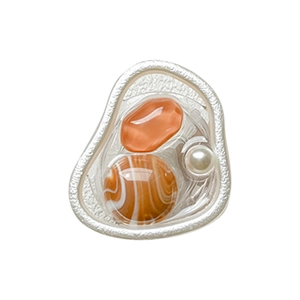 Artistic retractable phone grip with silver textured frame, orange stones and white pearl