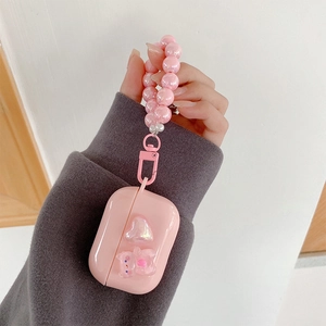 Pink heart AirPods case with cute bear charm and pearly beaded hand strap keychain