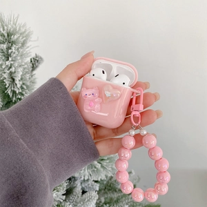 Pink heart cat Airpods case with iridescent pearl strap held in hand for women